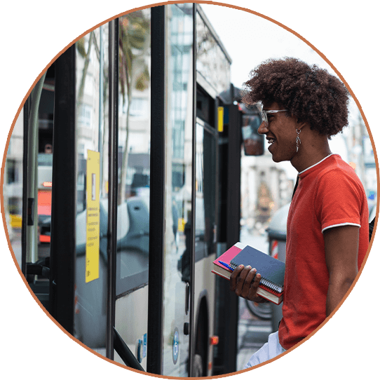 Young man entering a bus